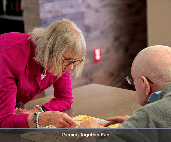 Residents engaging in a puzzle activity at a table