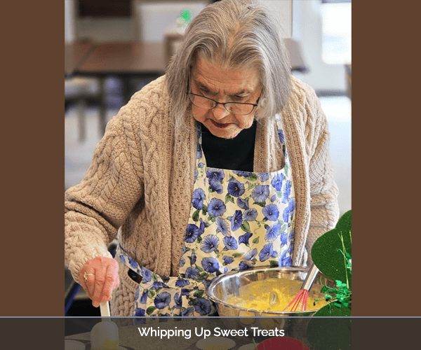 Resident preparing sweet treats in a lively kitchen activity