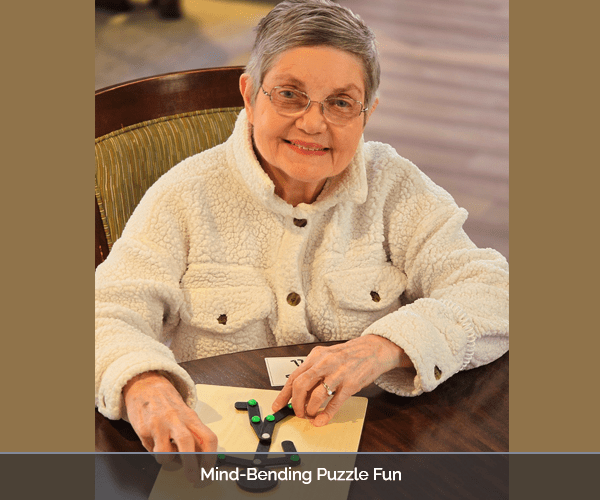 A resident enjoying a puzzle activity in the facility