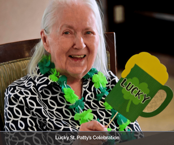 Resident celebrating St. Patrick's Day with festive accessories