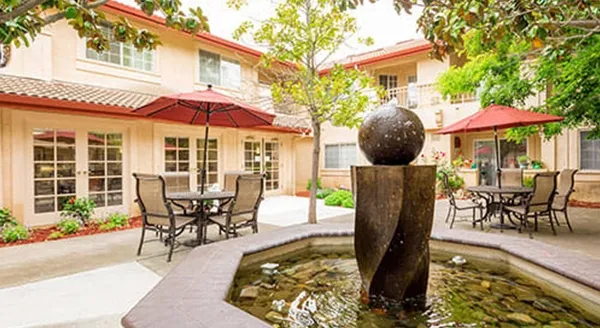 Outdoor courtyard with seating and a fountain