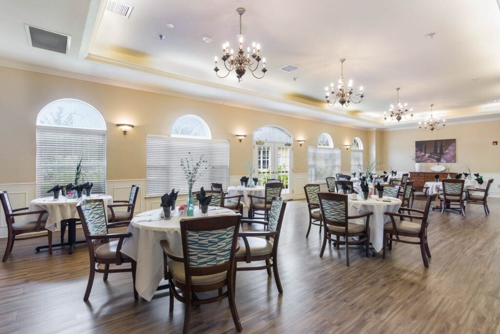 Dining area with tables set for residents