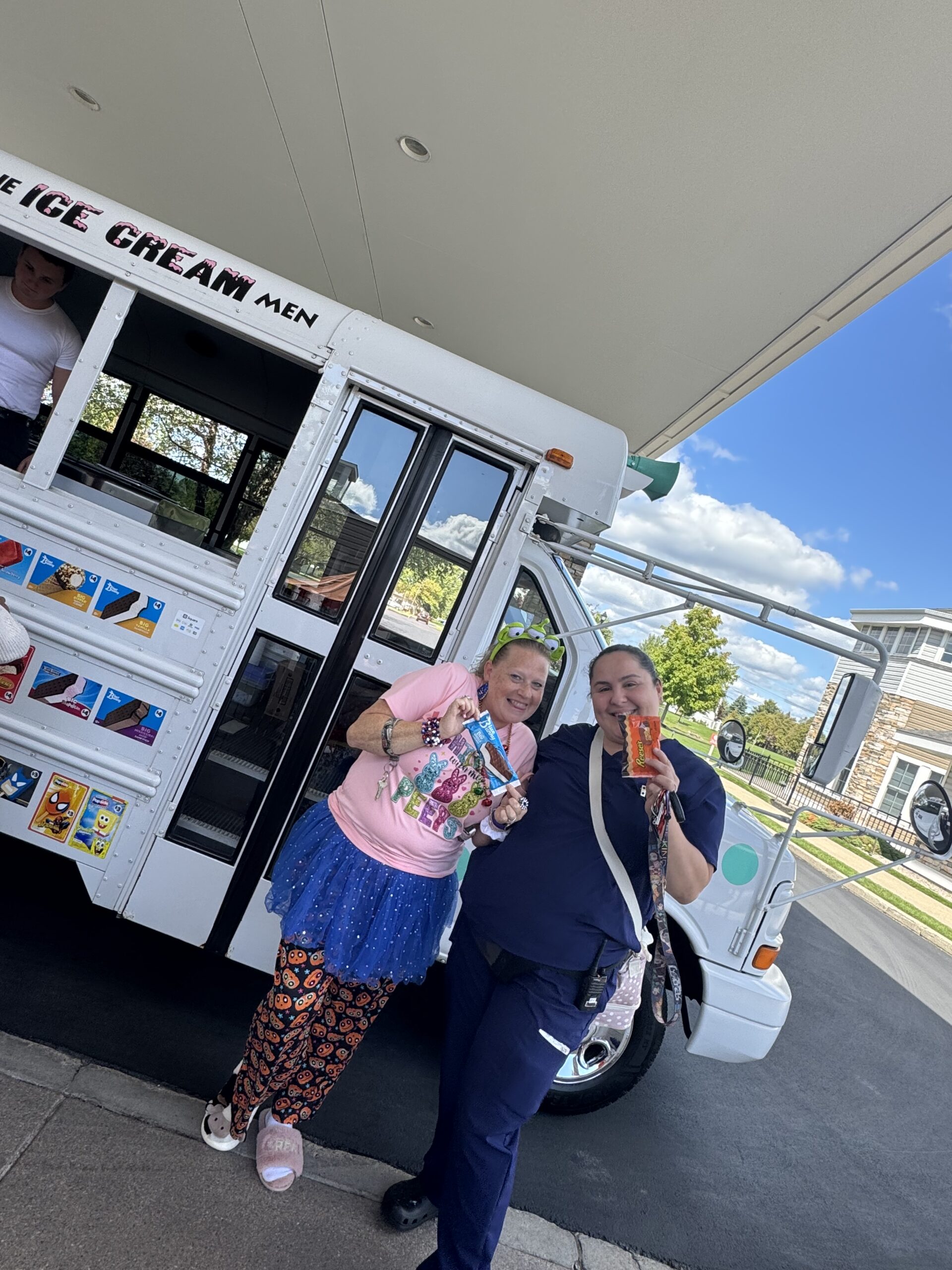 Staff and residents enjoying ice cream from a food truck
