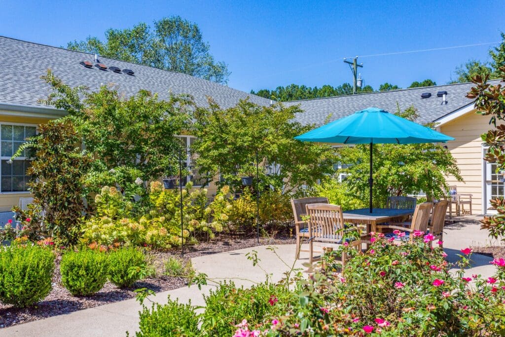 Outdoor garden space with seating and umbrella