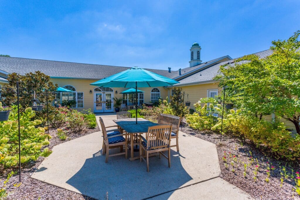 Outdoor seating area with umbrellas and greenery