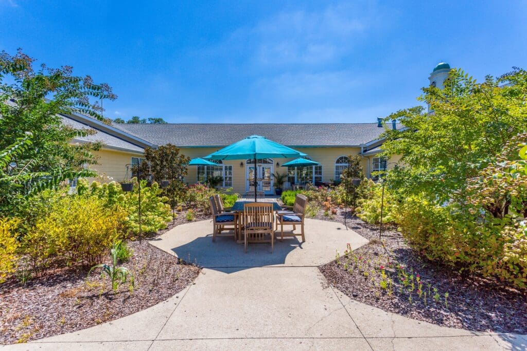 Outdoor seating area with tables and umbrellas