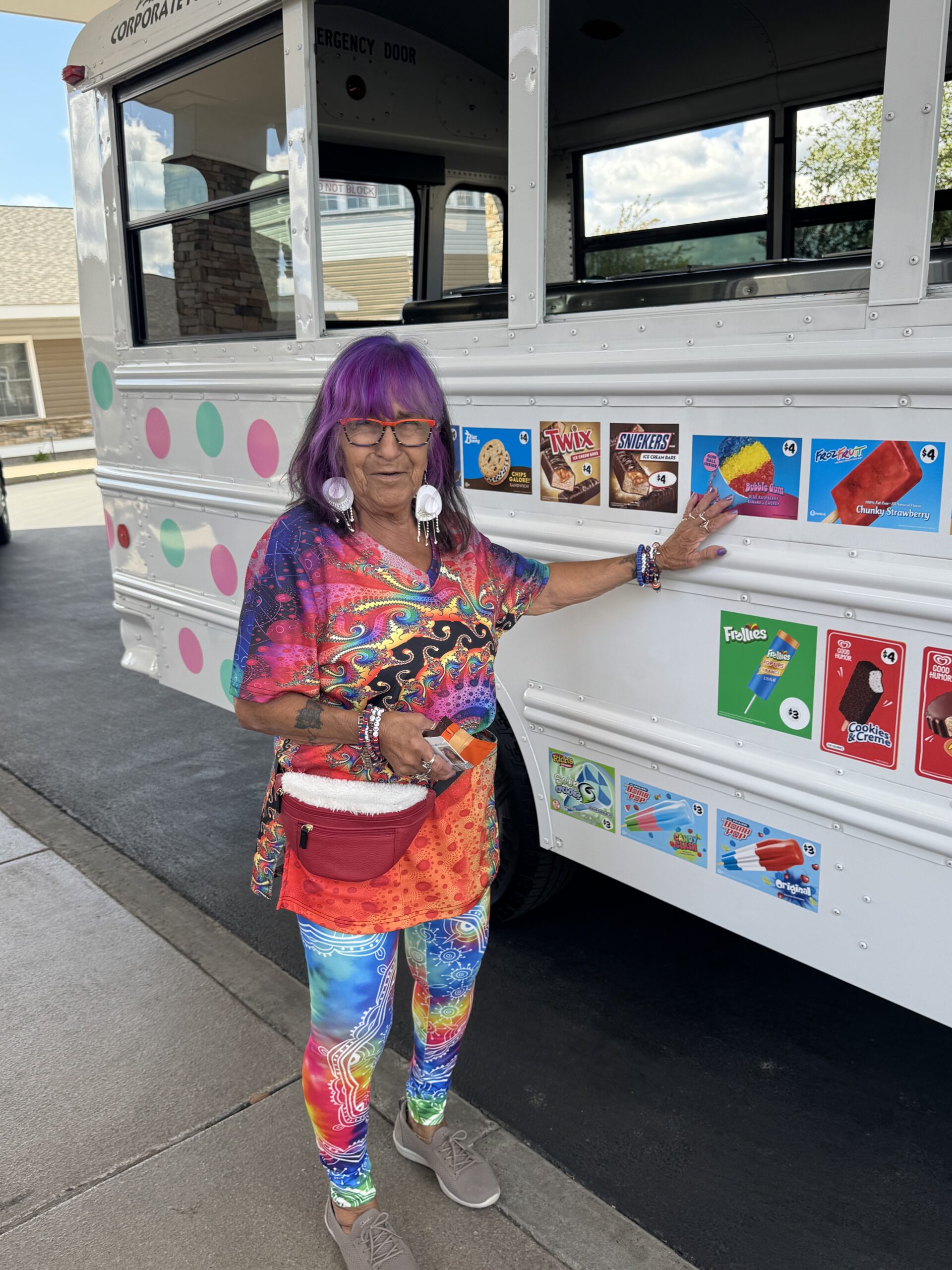 A resident in colorful clothing at an ice cream cart