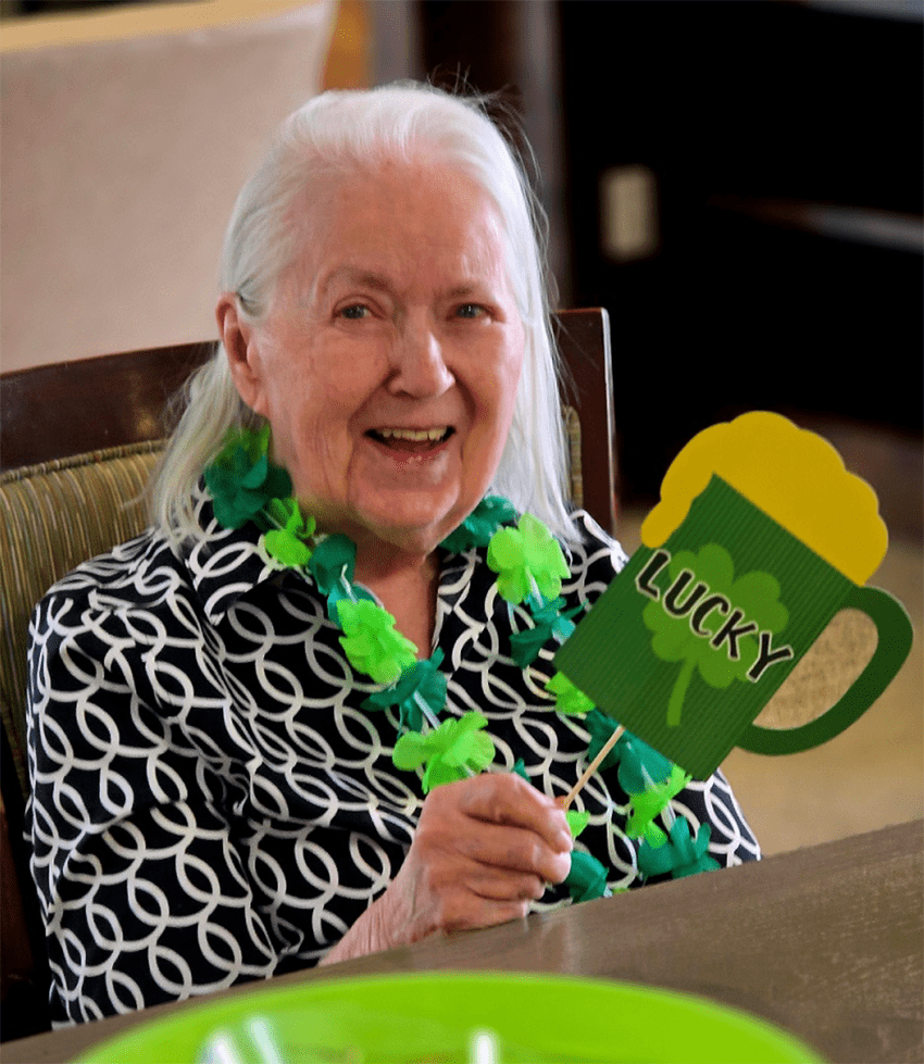 Resident celebrating with a festive drink