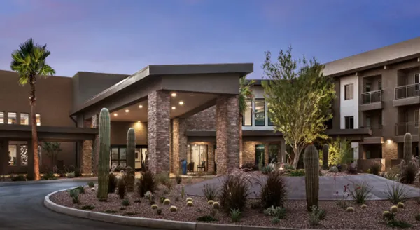 Exterior view of assisted living facility with landscaping