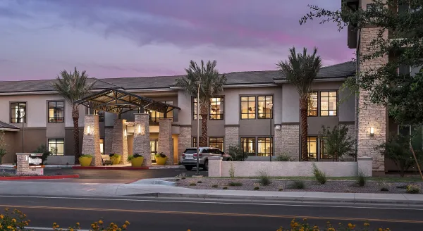 Exterior view of Cadence at Olney facility with palm trees