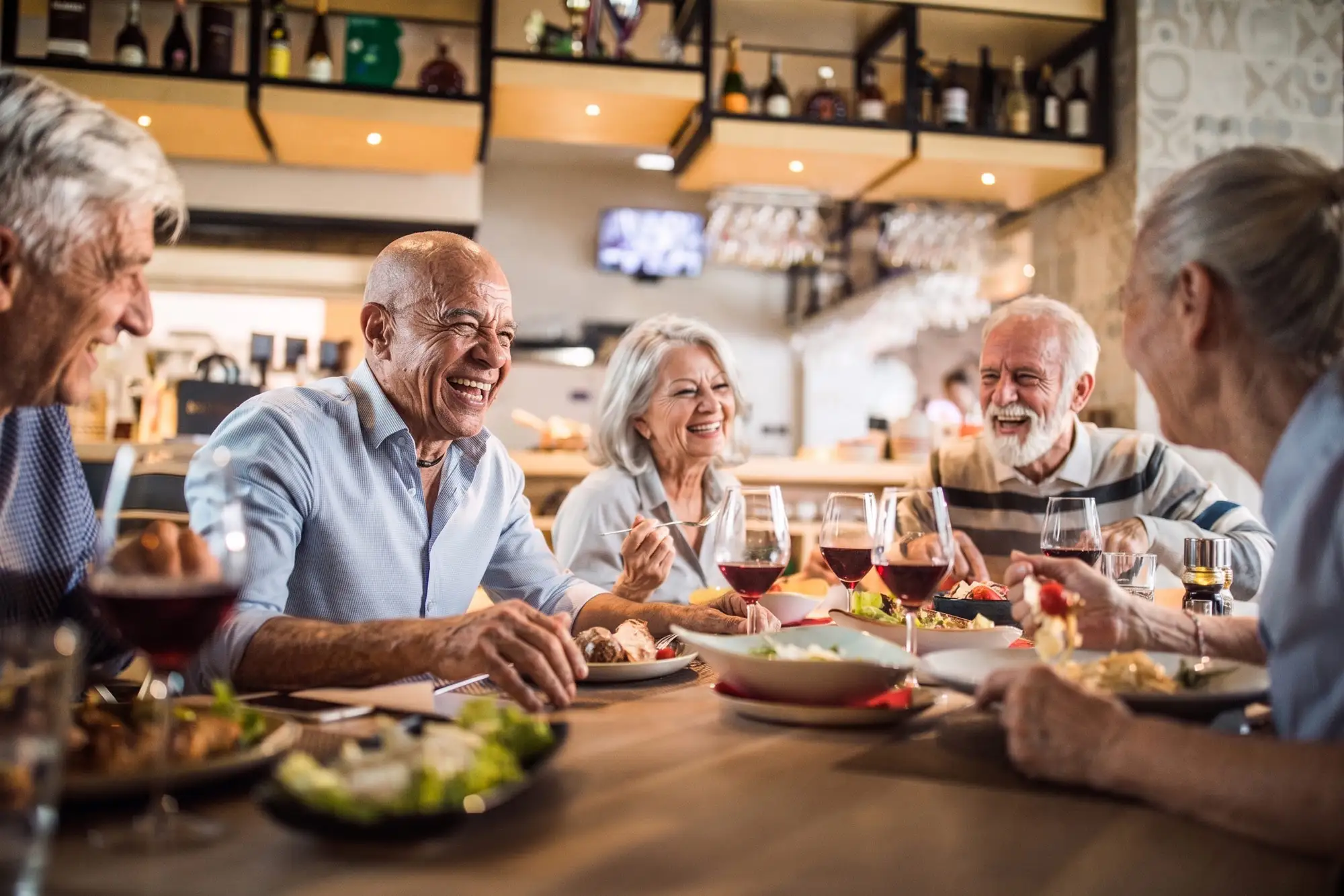 Seniors enjoying a meal together in a dining area