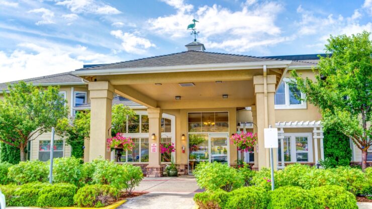 Front entrance of Cadence at Olney with landscaping