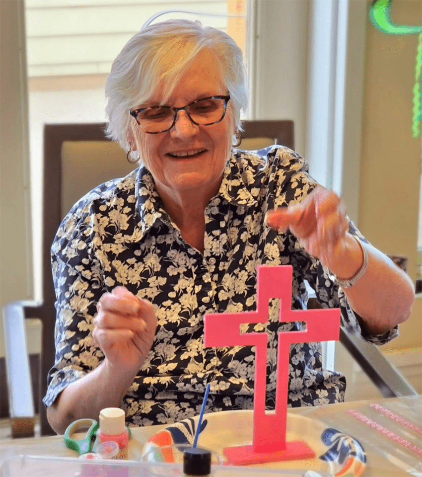 Resident participating in a craft activity