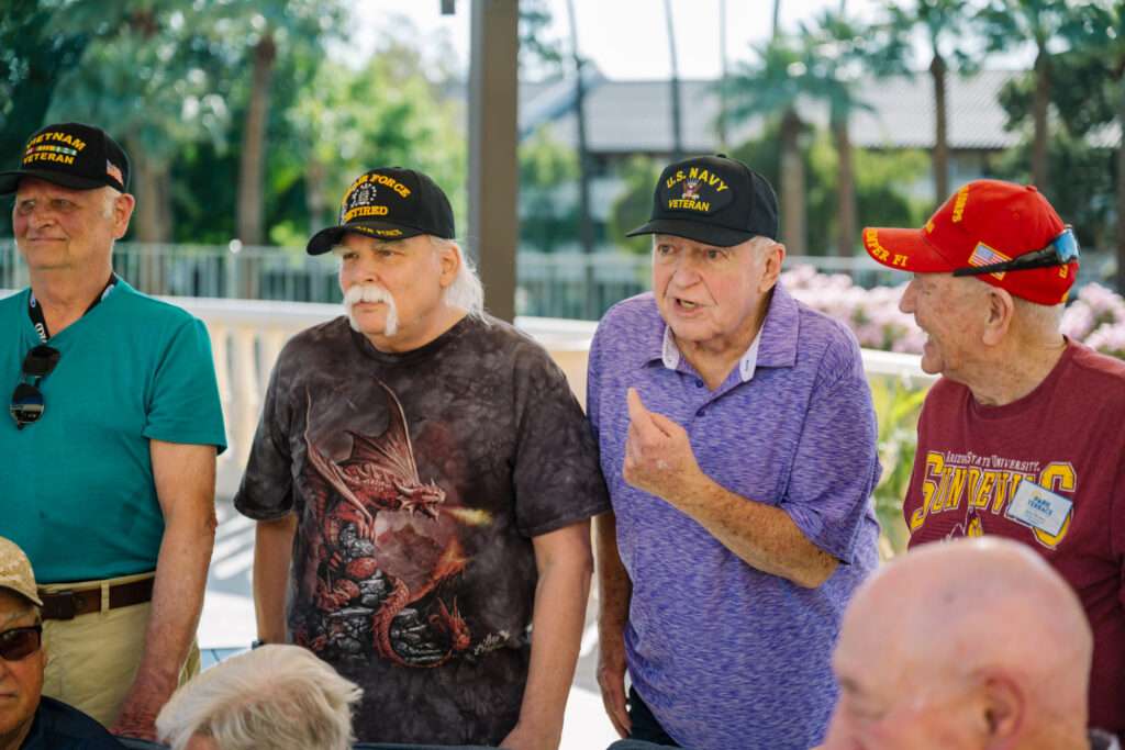 Veterans interacting in an outdoor space at ACOYA Shea