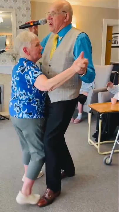 Residents dancing together in a common area
