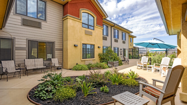 Outdoor seating area with landscaped garden