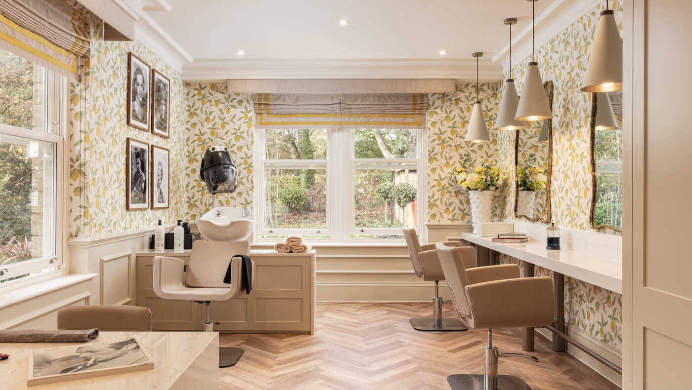 Hair salon area with styling chairs and natural light