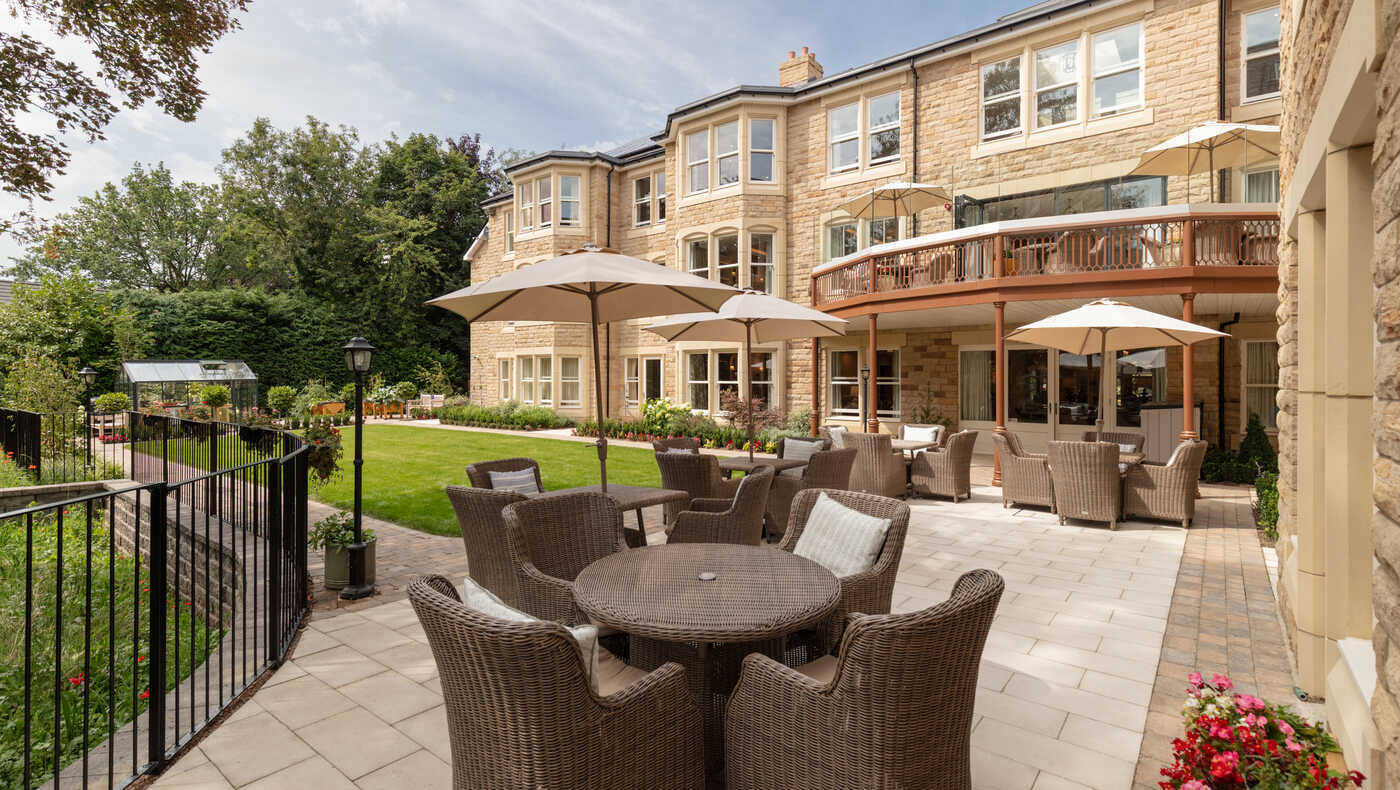 Outdoor patio area with seating and umbrellas