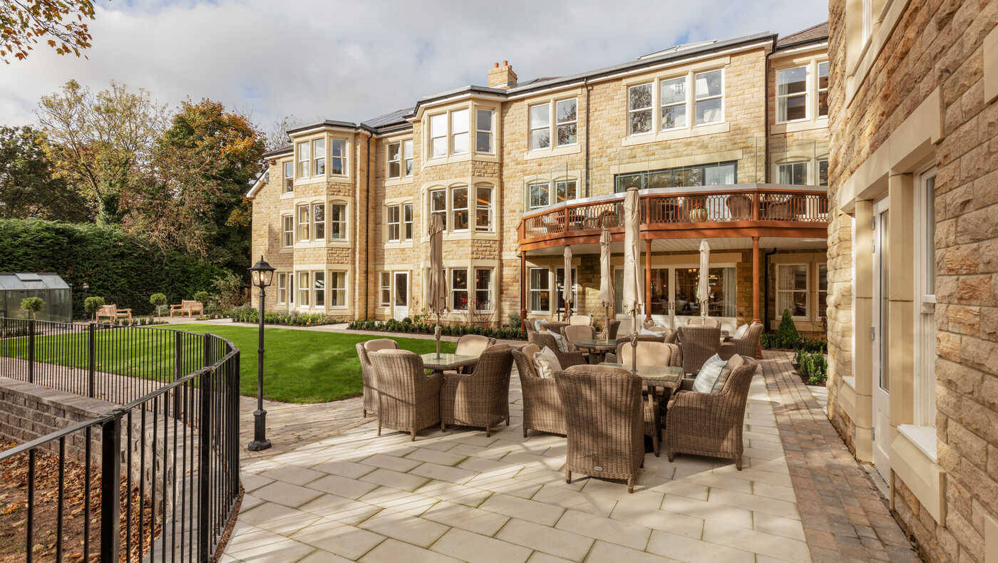 Outdoor seating area with building facade in the background