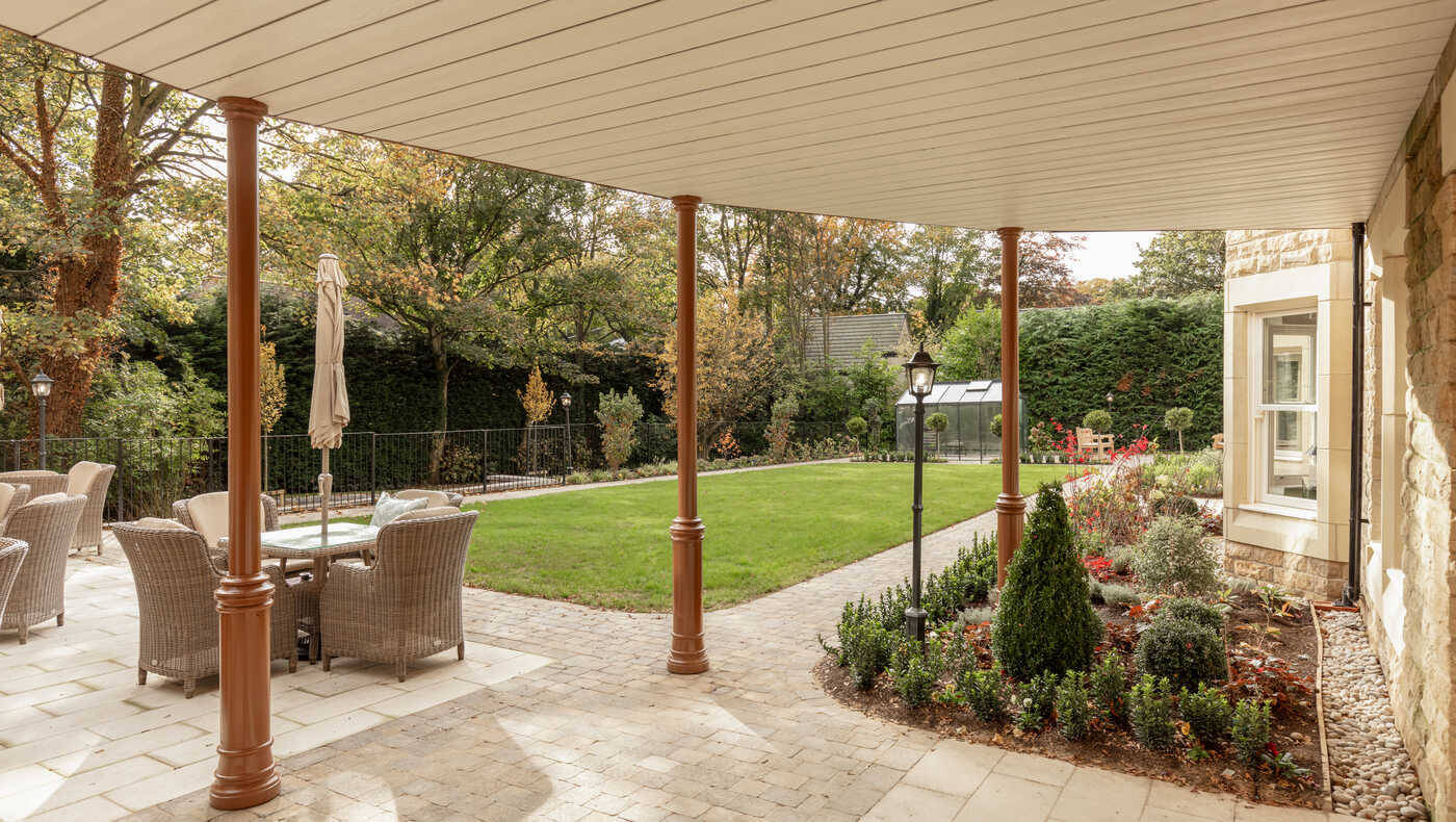 Outdoor patio area with seating and garden
