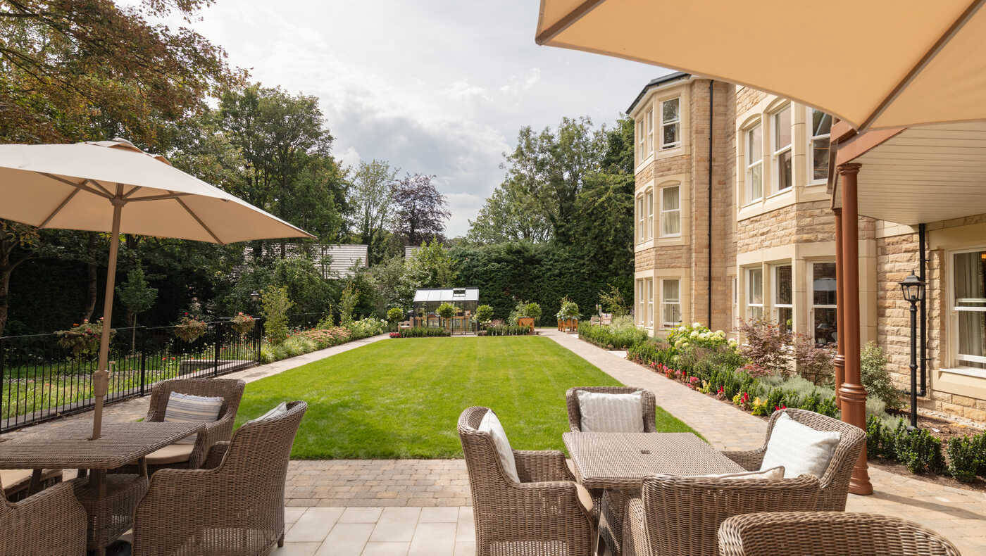 Outdoor space with seating and landscaped garden