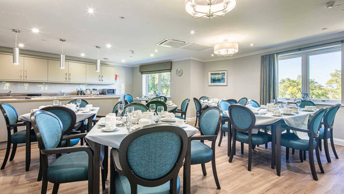 Dining room setup with tables and chairs