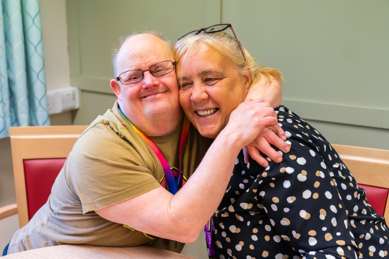 Residents sharing a joyful moment during an activity