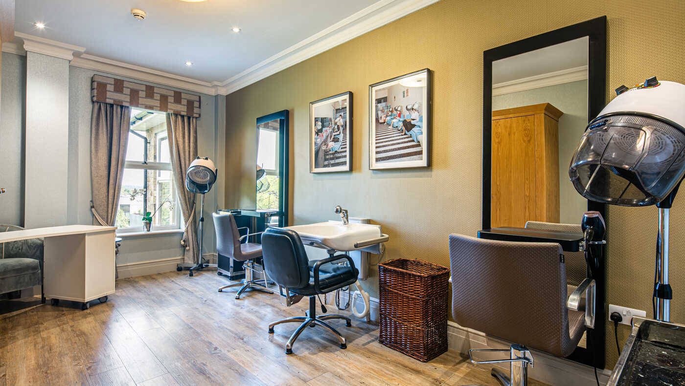 Facility interior showing a hair salon area