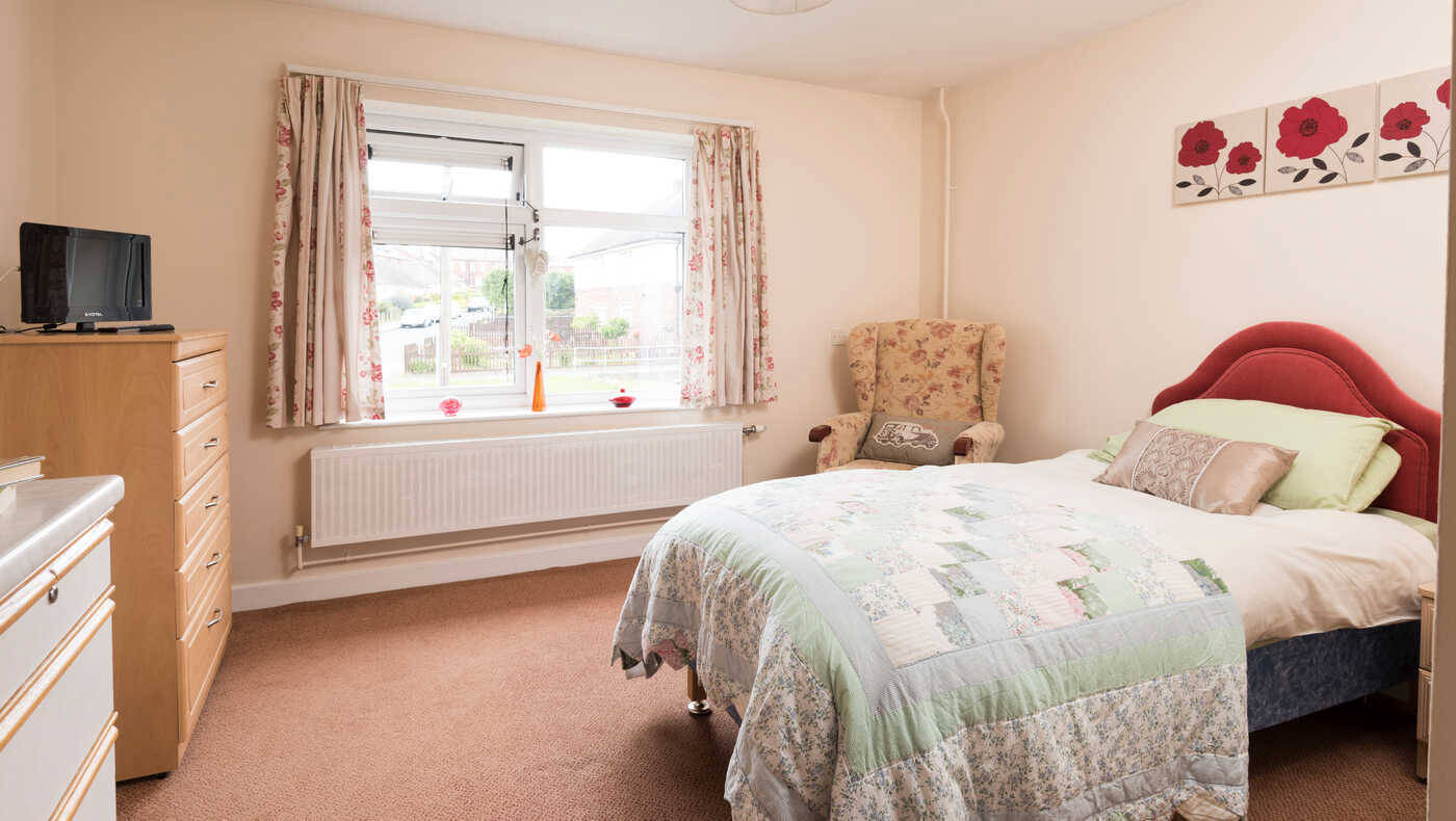 Cozy private bedroom in a senior living facility