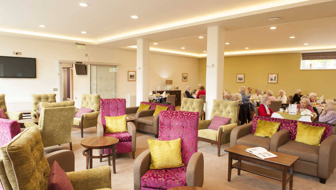 Bright common area with residents socializing