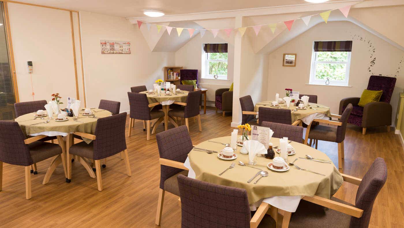 Dining area with tables set for a meal