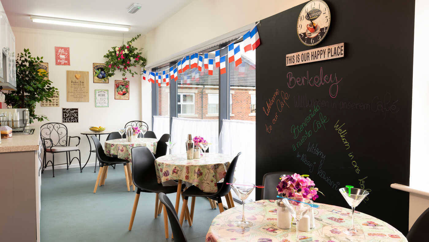 A bright common area with tables and decorations