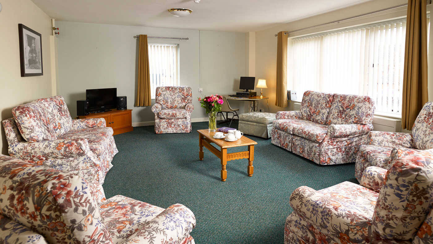 Comfortable common area with floral-patterned seating