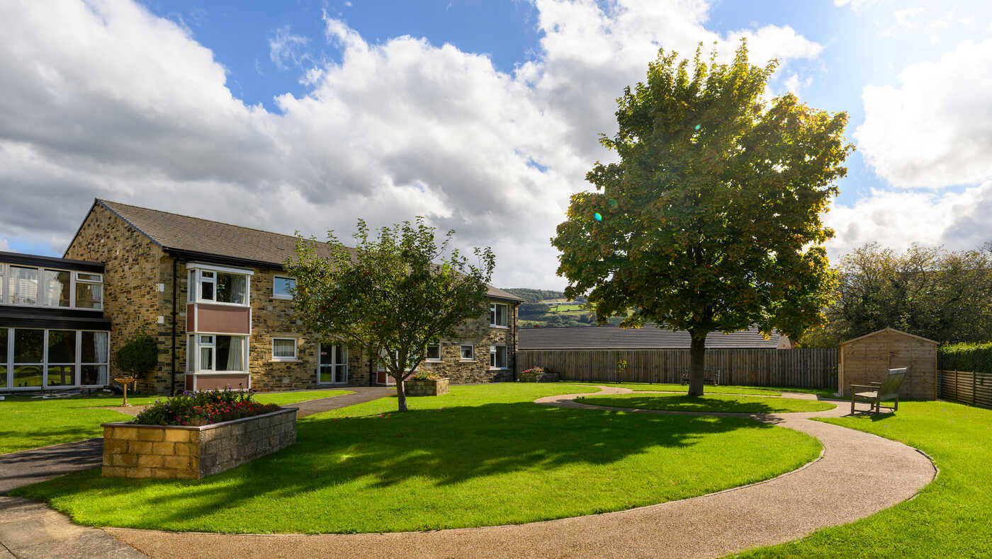 Outdoor view of Mill View facility with landscaped grounds