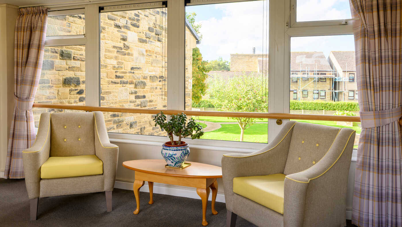 Cozy indoor seating area with a view of the garden