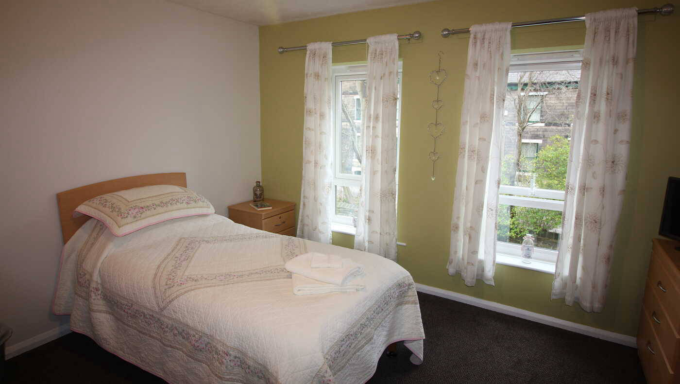 Cozy resident bedroom with natural light