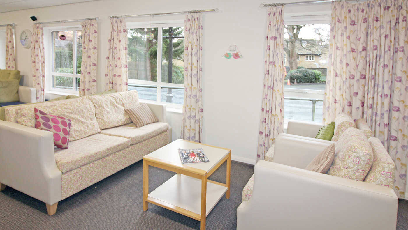 Bright common area with seating and windows