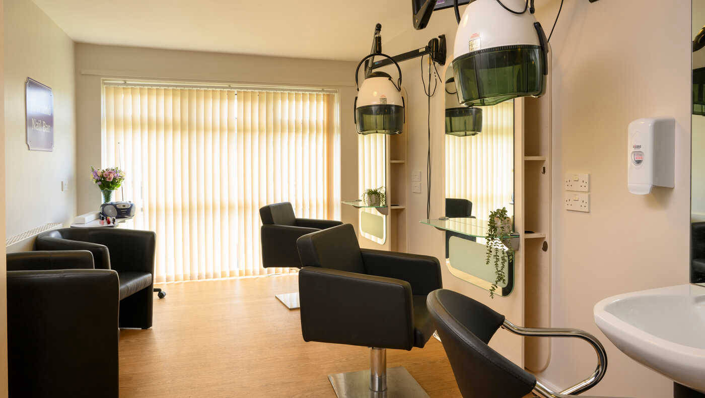 Bright salon area with hair styling stations
