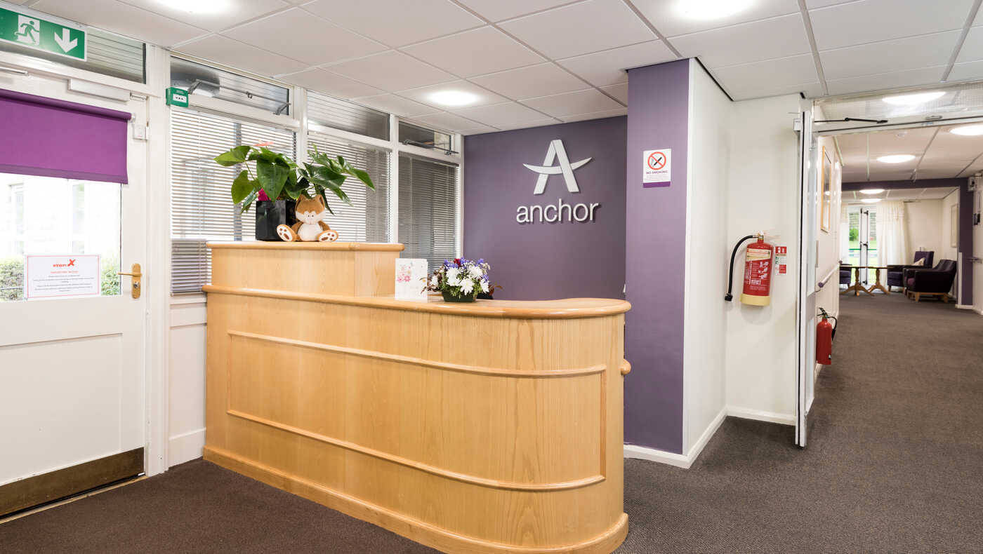 Interior view of a reception area with wooden counter