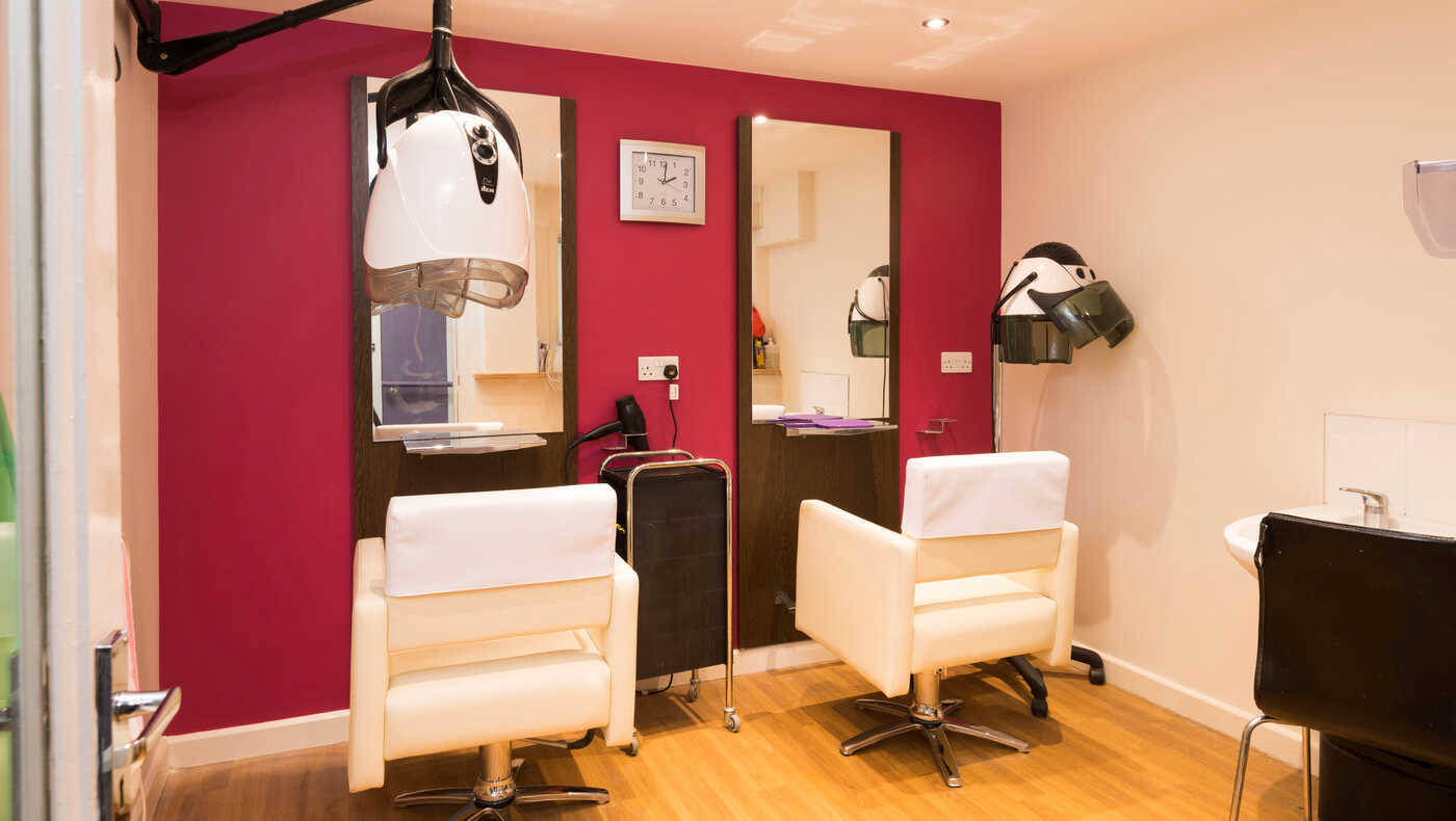 Hair salon area with styling chairs and equipment