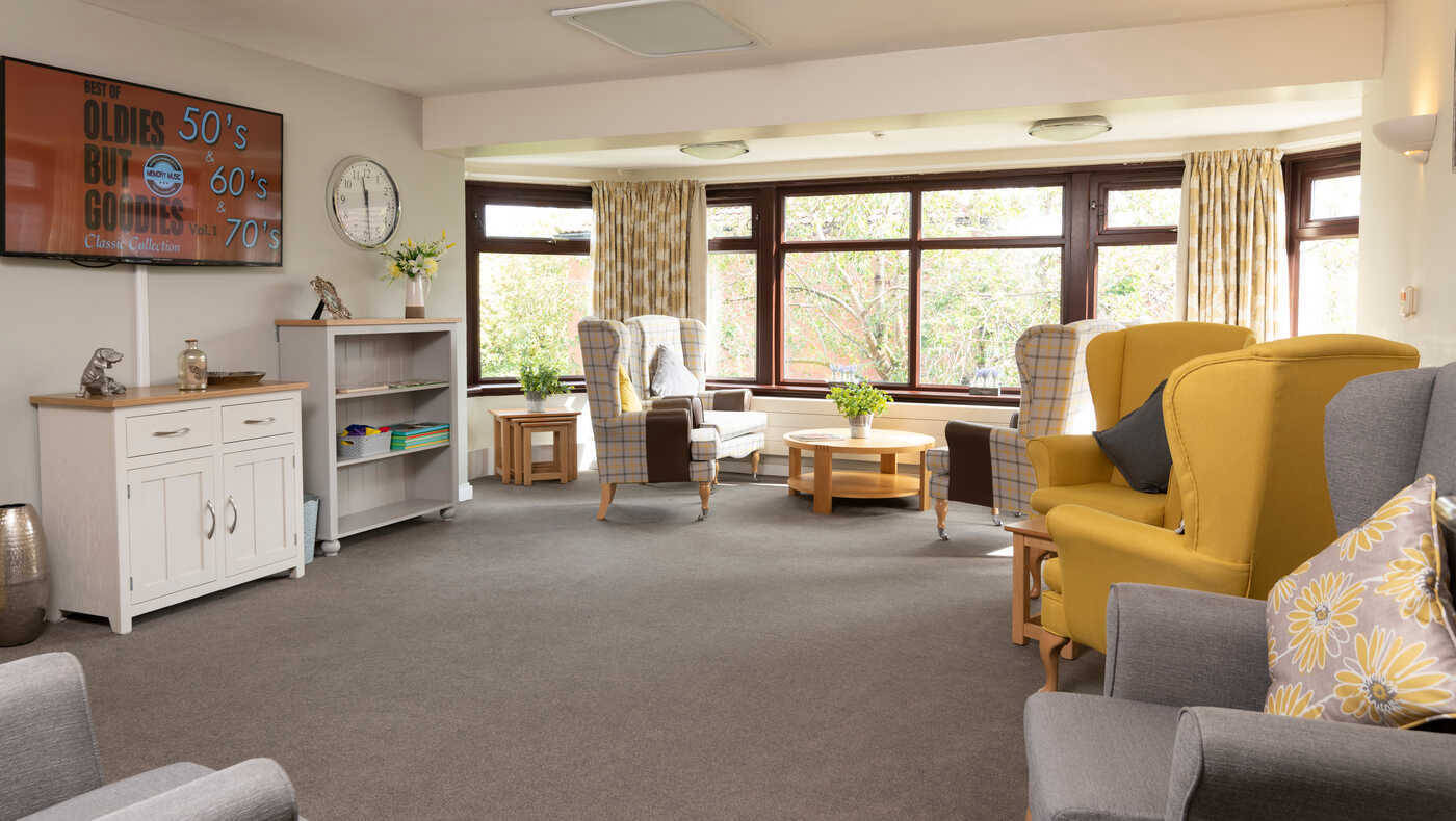 Bright common area with comfortable seating and large windows
