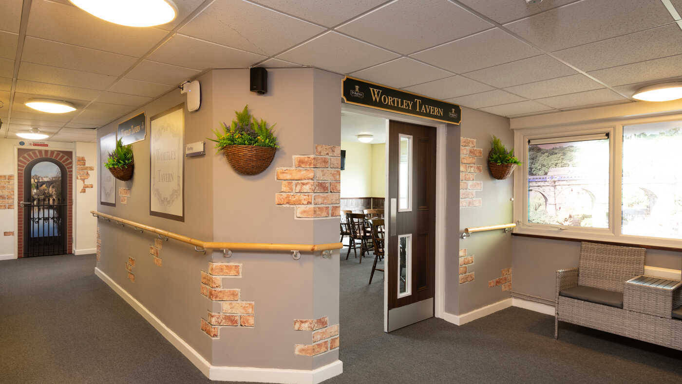 Interior view of a lounge area with a door to the tavern