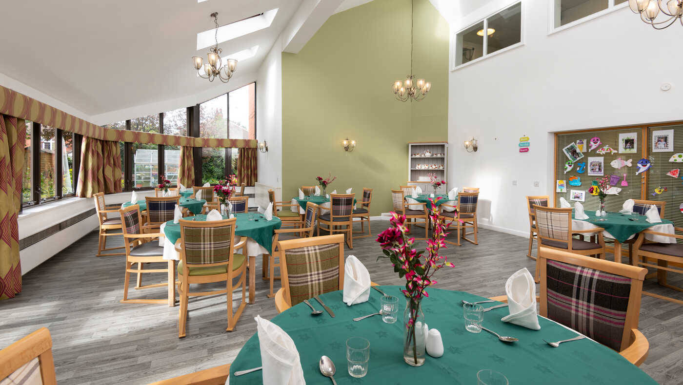 Bright dining room with tables and floral decorations
