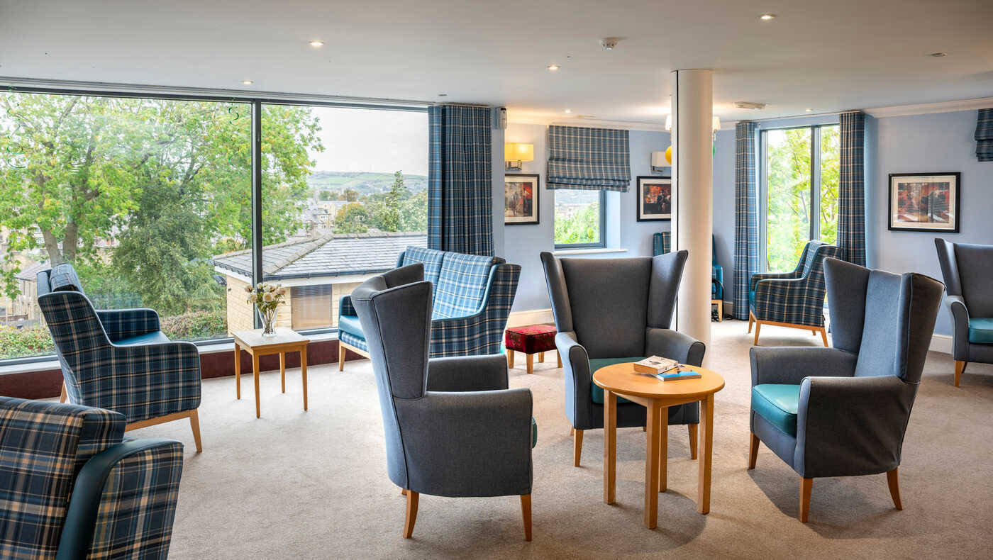 Bright common area with comfortable seating and large windows