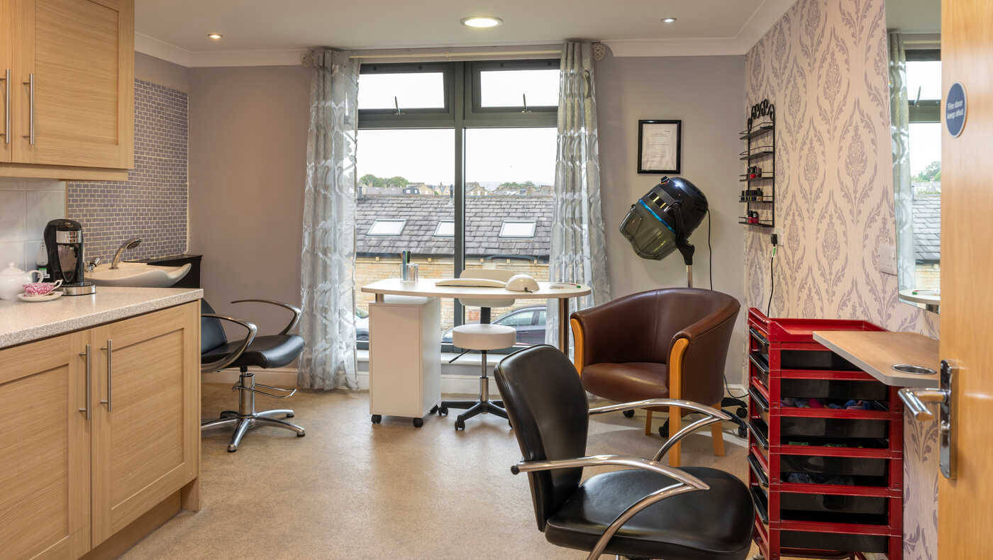 Beauty salon area with chairs and equipment