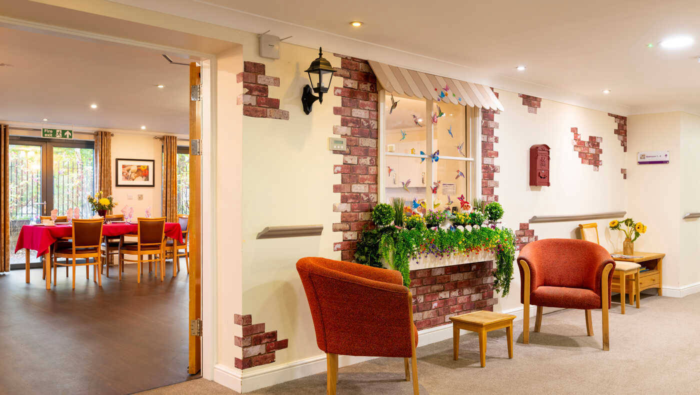 Bright common area with seating and dining tables