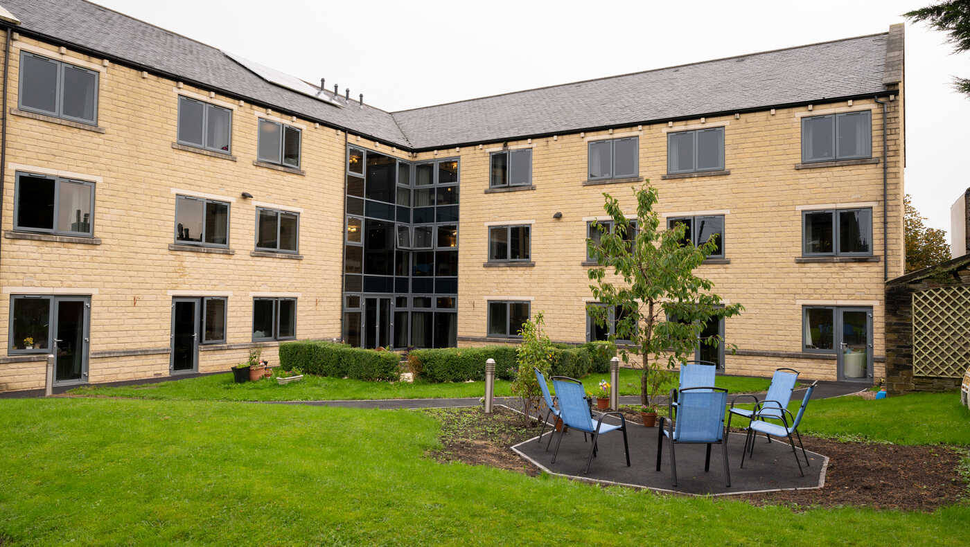 Exterior view of the facility with outdoor seating area