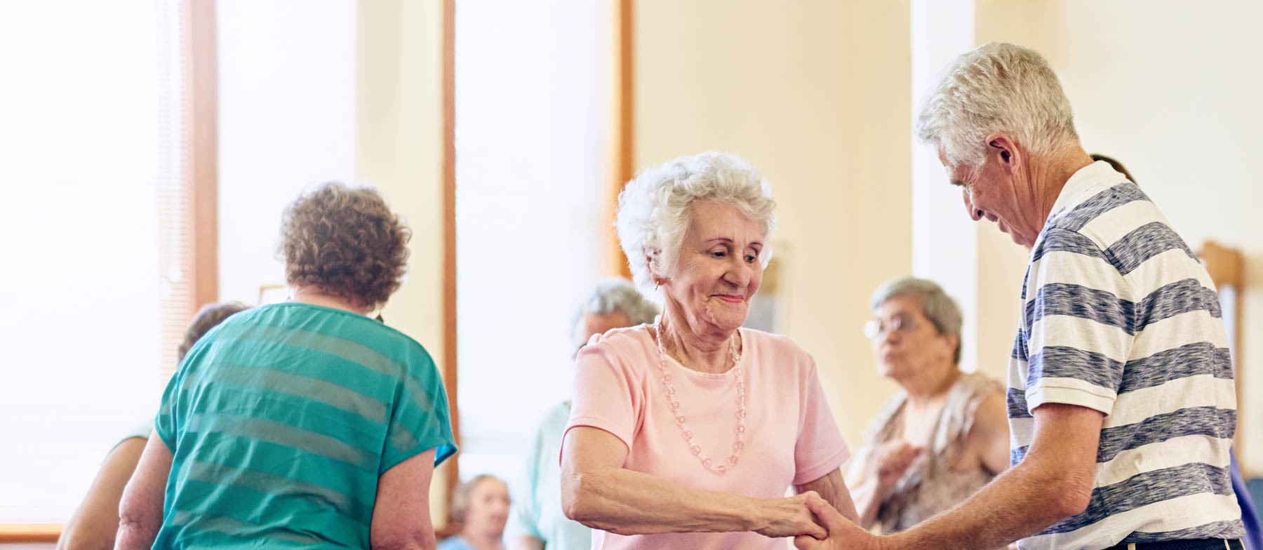 Residents engaging in a lively dance activity