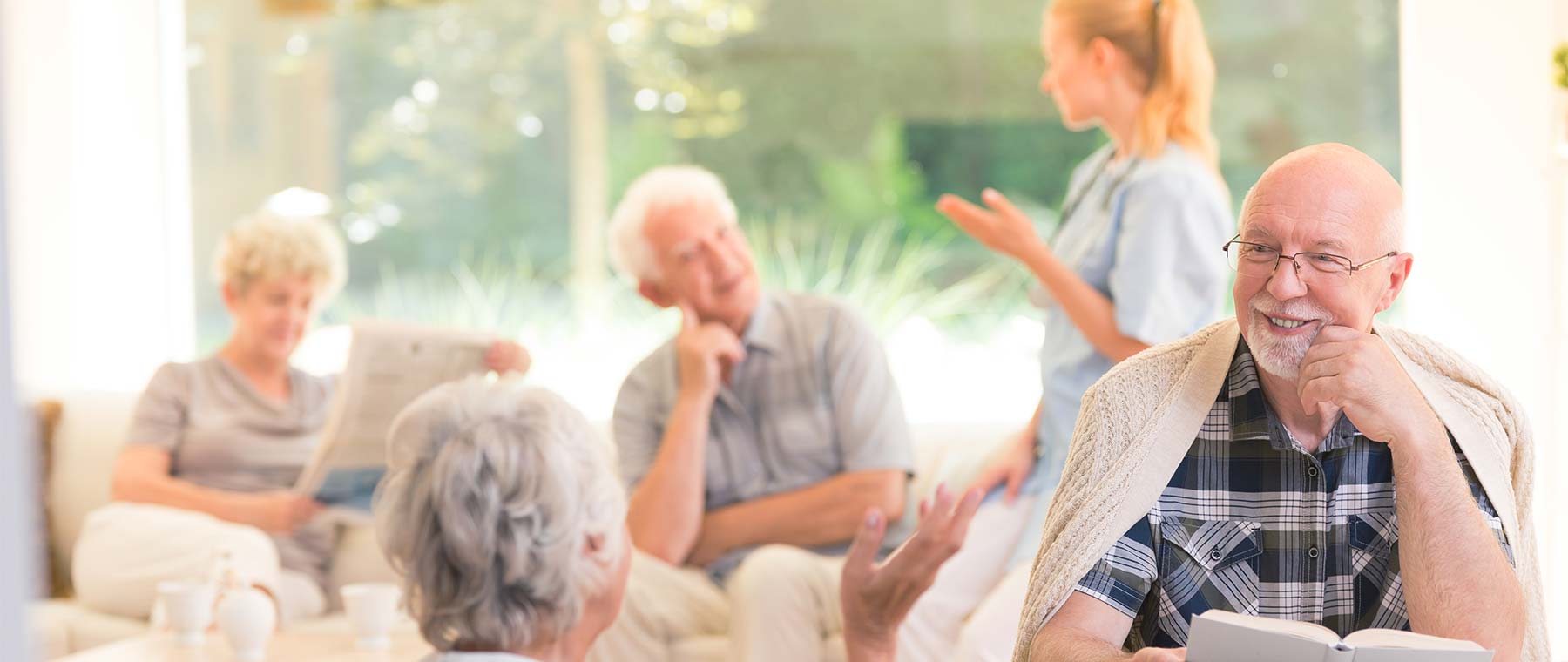 Residents socializing in a bright common area