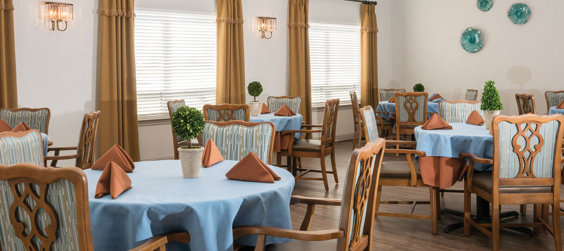Well-decorated dining area with tables set for meals